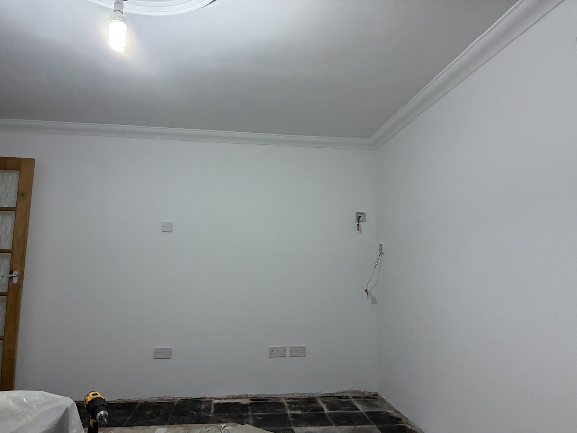 After plastering work showing a smooth white finish